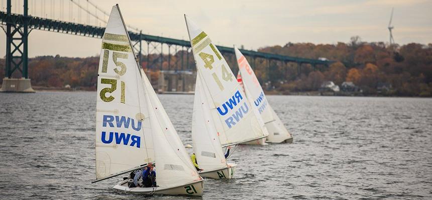 Sailing team practicing on RWU waterfront.